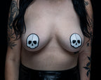 Black leather skull pasties with white skull design