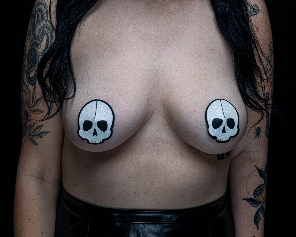 Black leather skull pasties with white skull design
