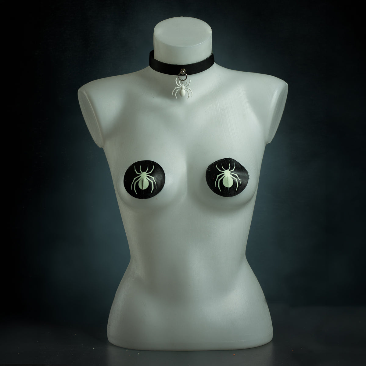 Arachne spider set: black leather choker with a white spider pendant and glow in the dark spider pasties by Wandering Chaos