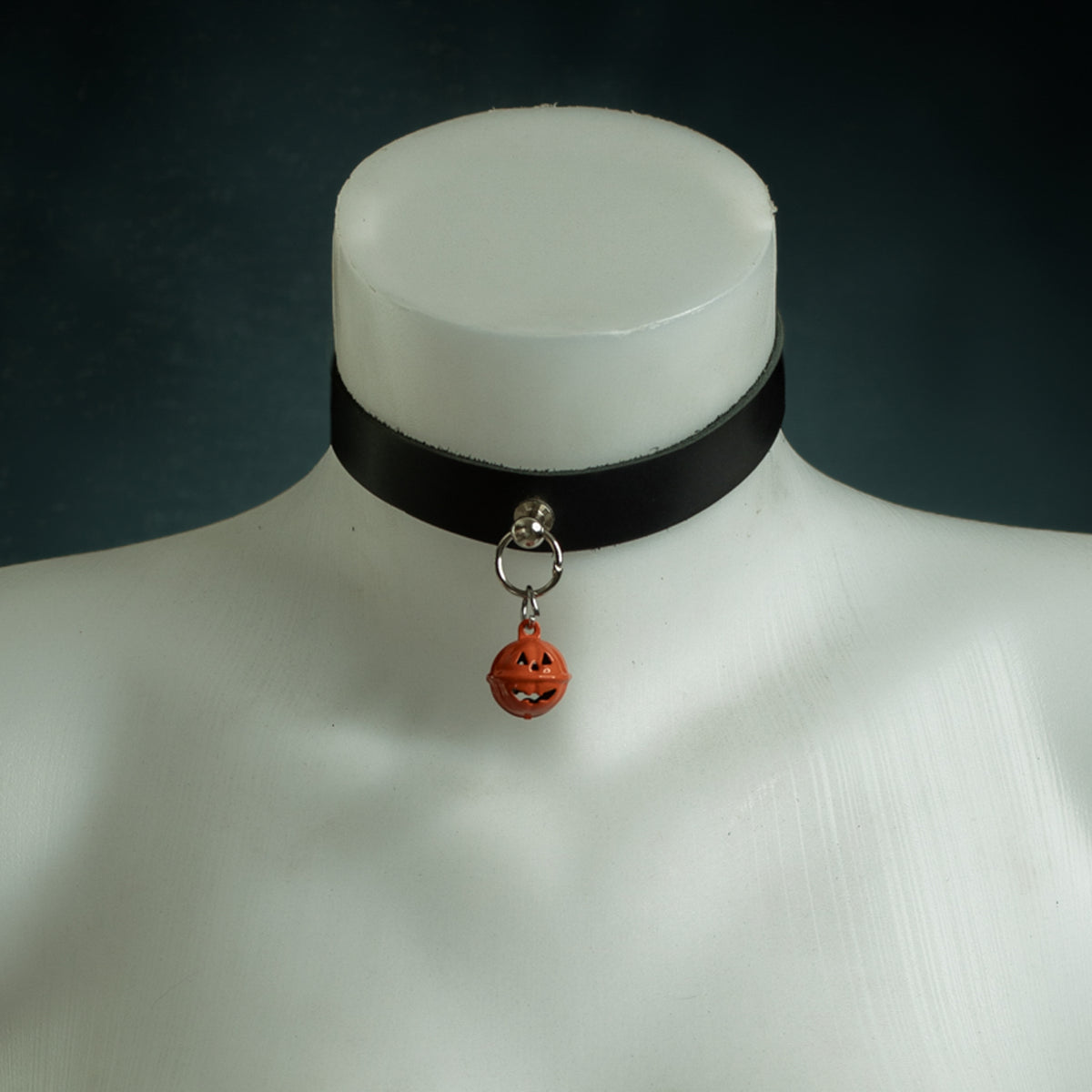 Samhain black leather choker with an orange jack-o'-lantern bell on a silver O-ring, Halloween Exclusive by Wandering Chaos